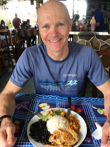 Andrew Hallam at Soda La Hormiga, La Fortuna, with a dinner that cost $4; photo courtesy of Pele Hallam-Young